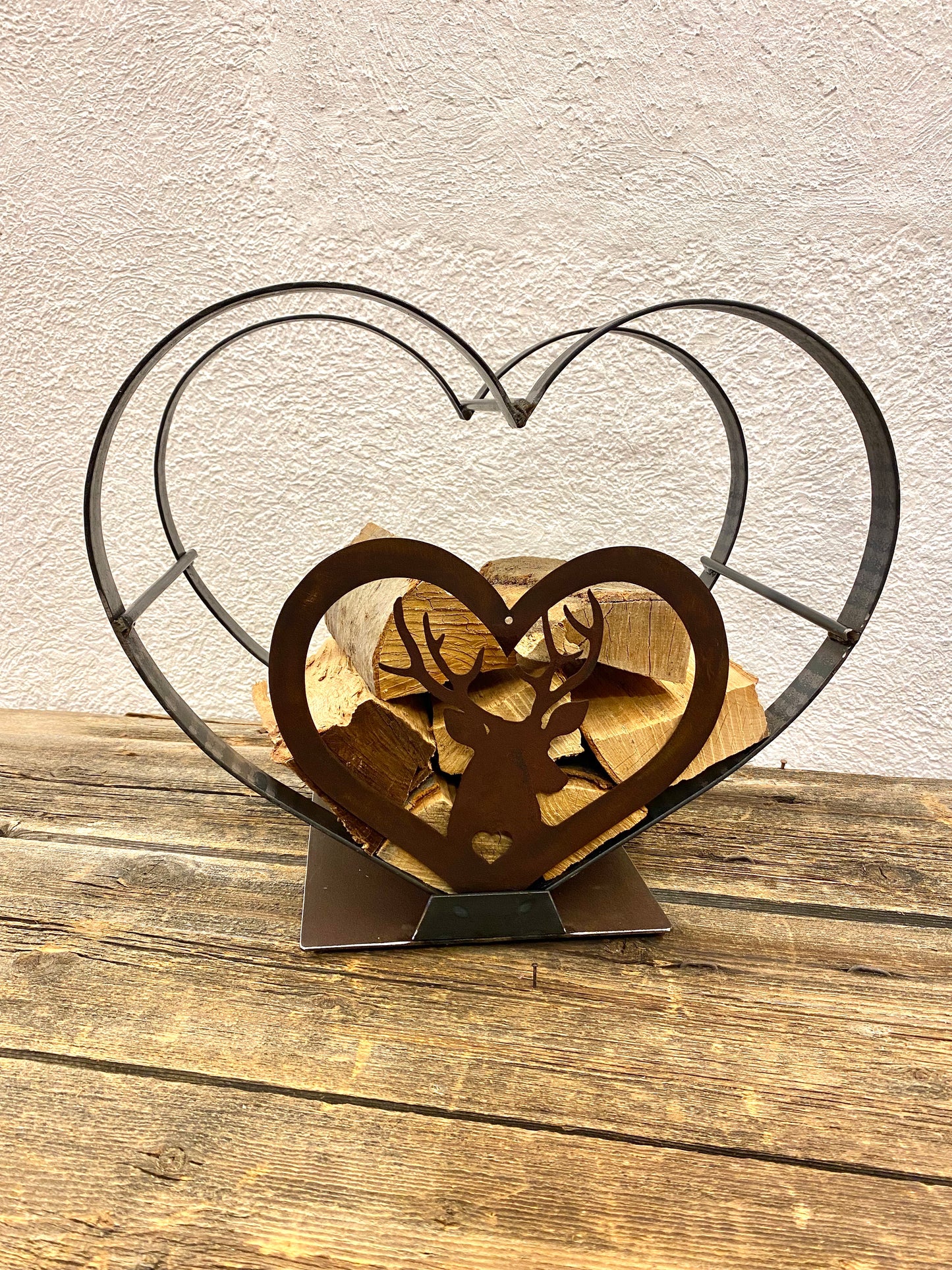 Heart shaped log holder with deer 