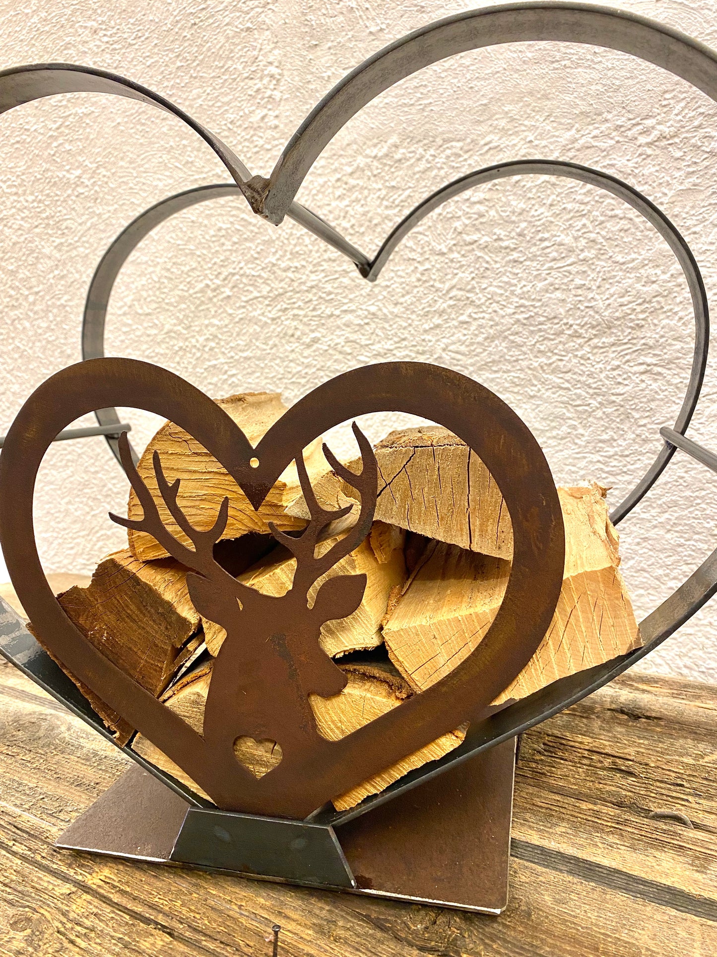 Heart shaped log holder with deer 