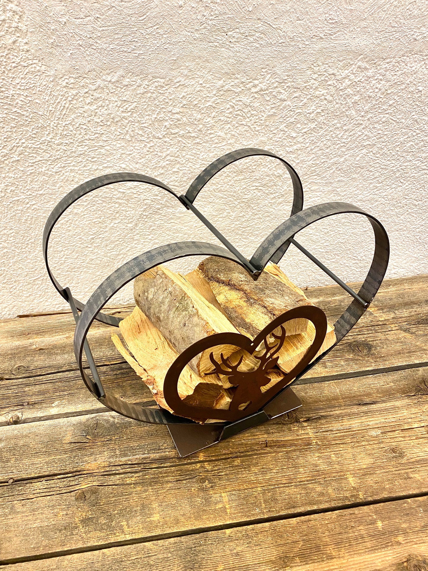 Heart shaped log holder with deer 